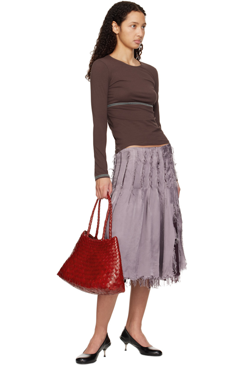 Handcrafted basket-woven buffalo calfskin tote in red.

· Twin carry handles
· Open throat
· Logo disc hand-sewn at interior
· Unlined
· H8.75" x W17.5" x D6"
· Total height: H17.5"

Supplier color: Poppy red