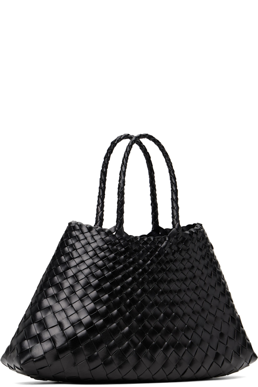 Handcrafted basket-woven buffalo calfskin tote in black.

· Twin carry handles
· Open throat
· Logo disc hand-sewn at interior
· Unlined
· H6.5" x W16" x D4.5"
· Total height: H14"

Supplier color: Black