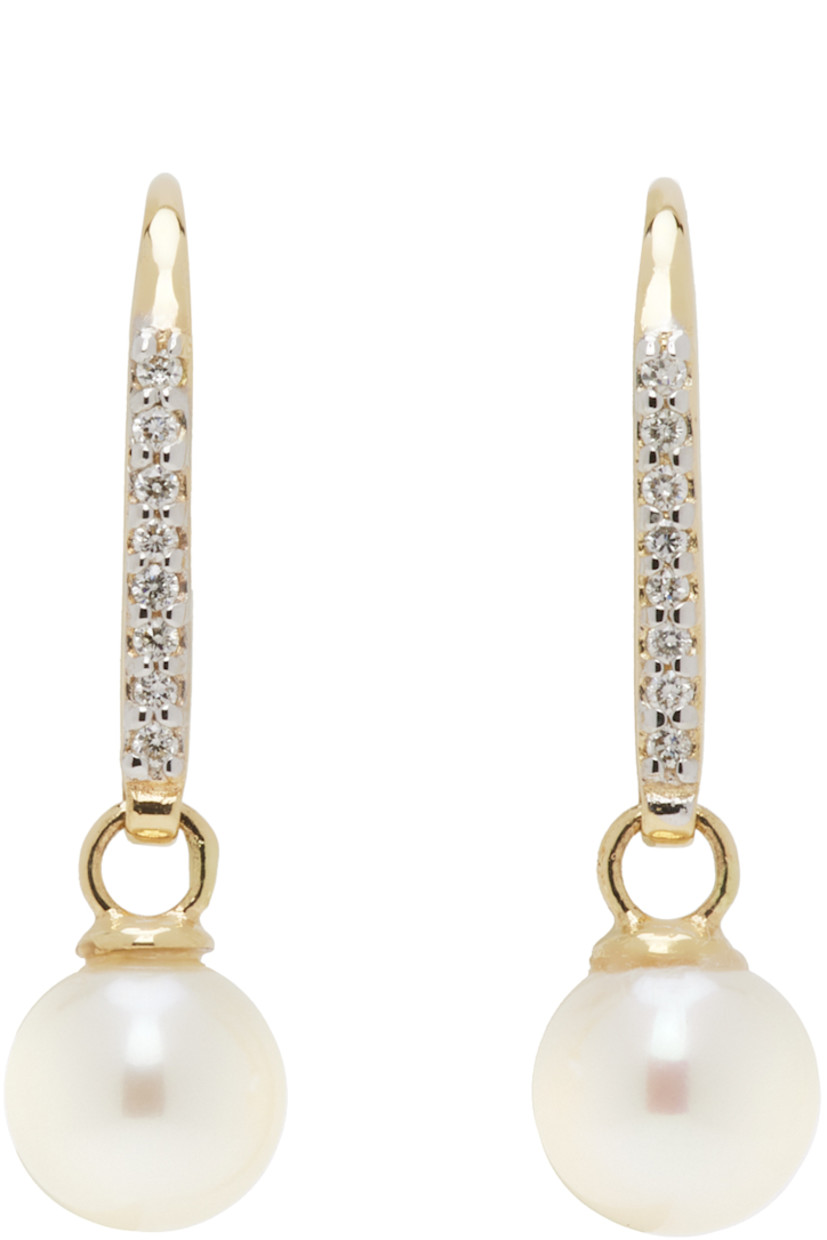Pair of drop earrings in 14k gold. 

· Hand-set 0.08 ct diamonds
· Freshwater pearl at drop
· Hook fastening
· H0.75" x W0.25"

Supplier color: 14kt yellow gold