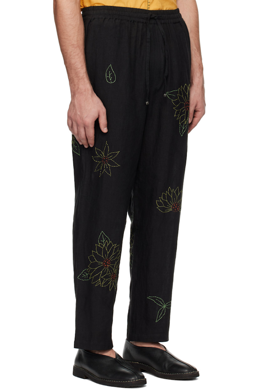 Hand-woven and naturally-dyed linen hopsack trousers. Floral pattern embroidered throughout.

· Drawstring at elasticized waistband
· Two-pocket styling
· Zip-fly

Supplier color: Black