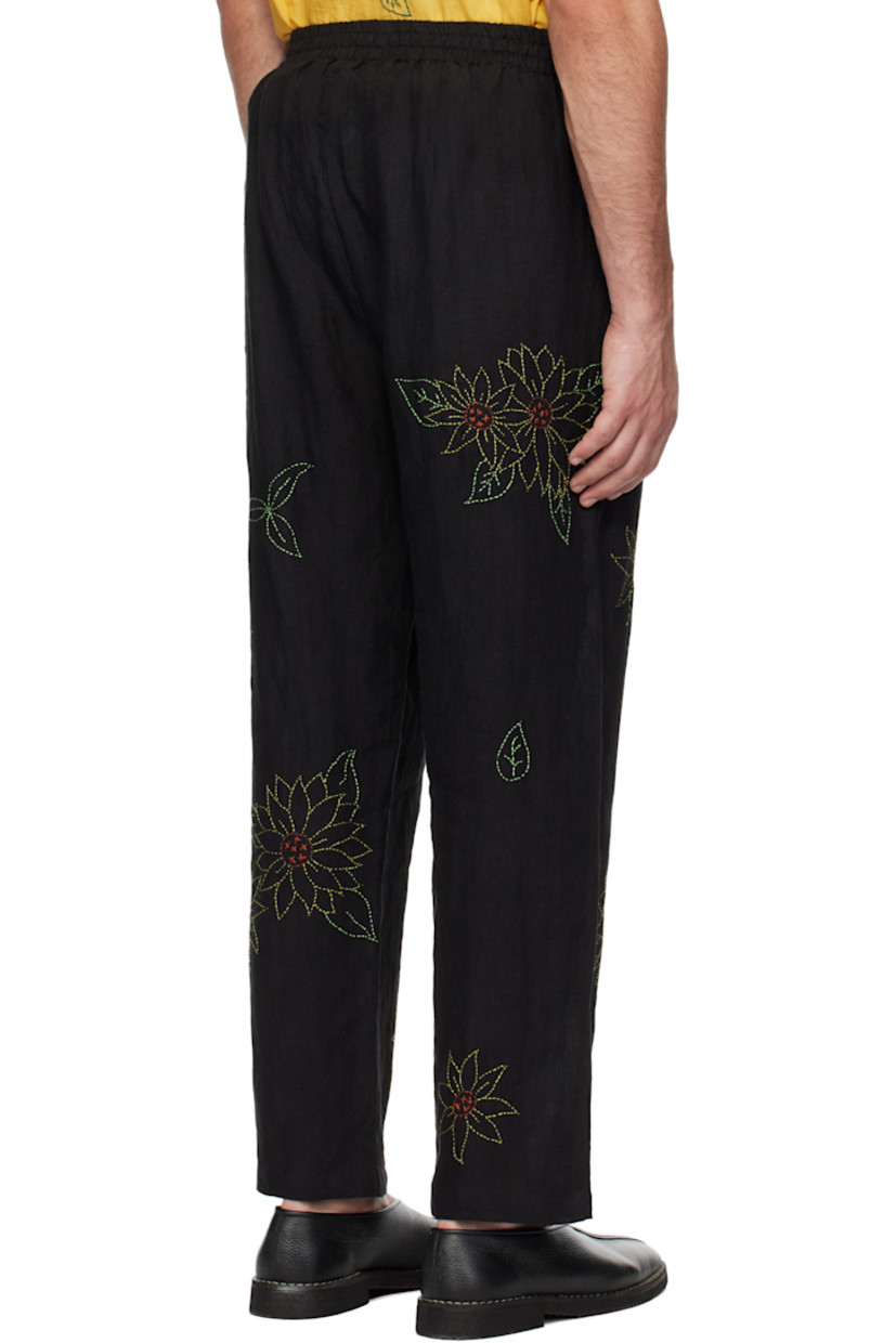Hand-woven and naturally-dyed linen hopsack trousers. Floral pattern embroidered throughout.

· Drawstring at elasticized waistband
· Two-pocket styling
· Zip-fly

Supplier color: Black