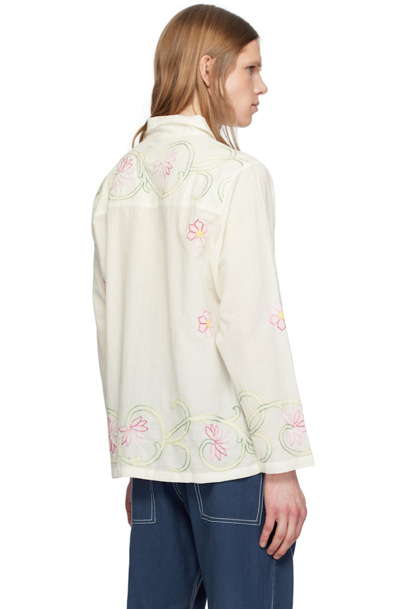 Hand-woven semi-sheer cotton double gauze shirt. Floral graphic pattern embroidered throughout. 

· Spread collar 
· Button closure
· Buttoned barrel cuffs

Supplier color: White