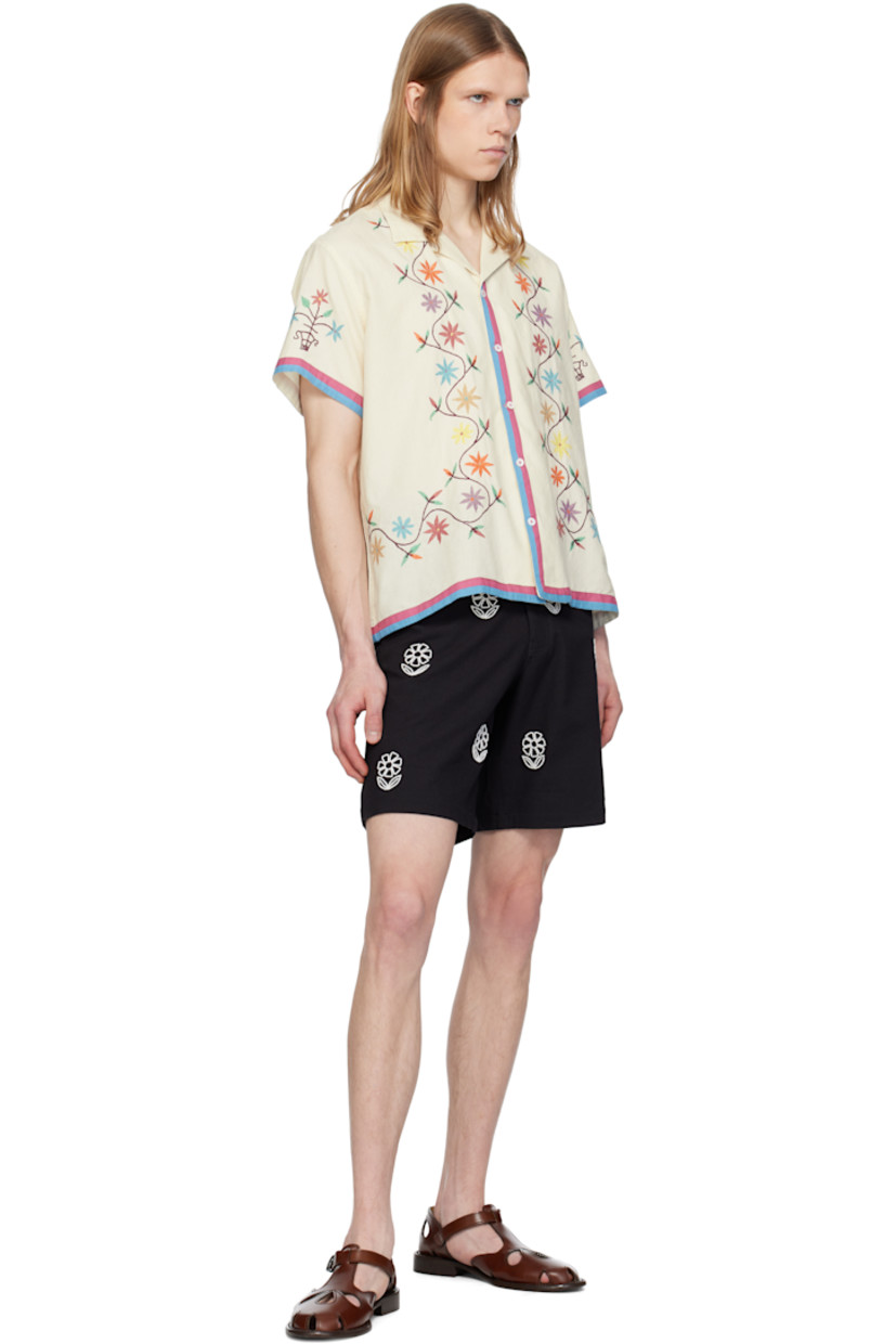 Hand-woven cotton hopsack shorts.

· Belt loops
· Four-pocket styling
· Zip fly 
· Beaded floral pattern at front 

Supplier color: Black
