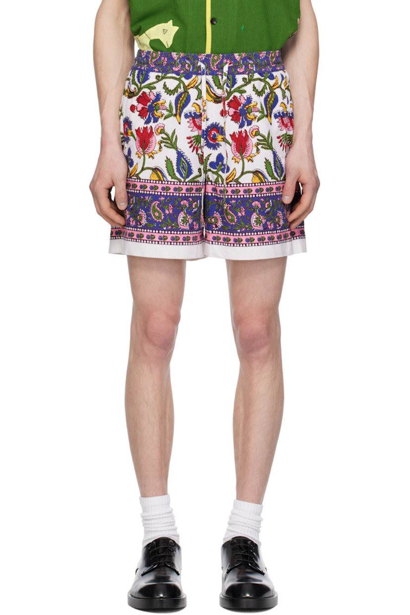 Hand-woven and hand-spun plain-woven cotton shorts. Floral graphic pattern printed throughout. 

· Drawstring at elasticized waistband
· Mock fly 
· Three-pocket styling

Supplier color: White