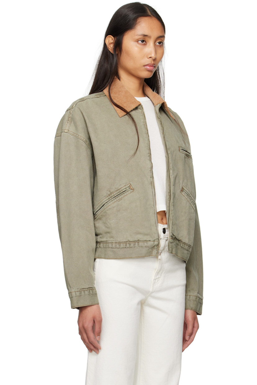 Garment-dyed cotton canvas jacket. Fading throughout.

· Corduroy spread collar
· Zip closure
· Zip pocket at chest
· Welt pockets at front
· Dropped shoulders
· Twin pleats at back hem
· Contrast stitching in tan

Supplier color: Faded olive