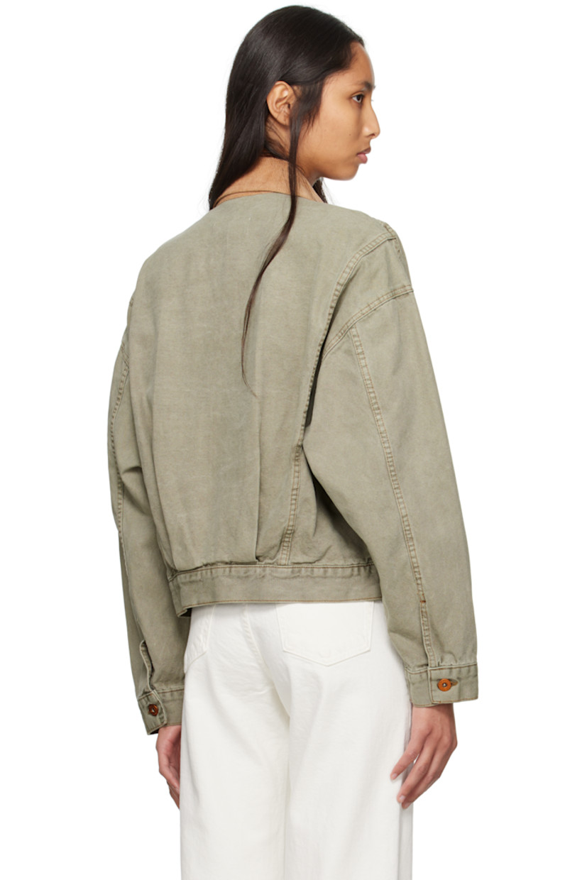 Garment-dyed cotton canvas jacket. Fading throughout.

· Corduroy spread collar
· Zip closure
· Zip pocket at chest
· Welt pockets at front
· Dropped shoulders
· Twin pleats at back hem
· Contrast stitching in tan

Supplier color: Faded olive