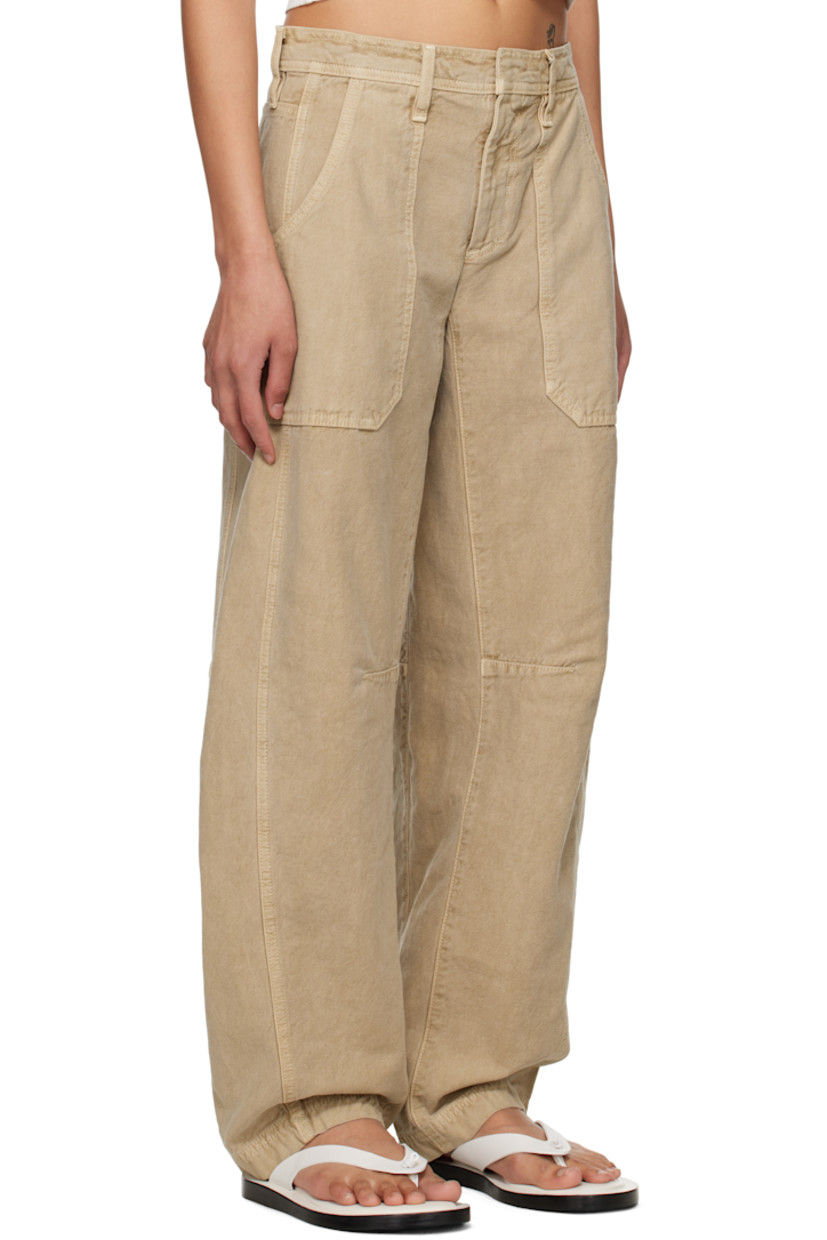 Tapered garment-dyed lightweight cotton canvas cargo pants. 

· BCI-certified
· Low-rise
· Belt loops
· Four-pocket styling
· Zip fly
· Tuck at knees
· Curved outseams

Supplier color: Marfa sands
