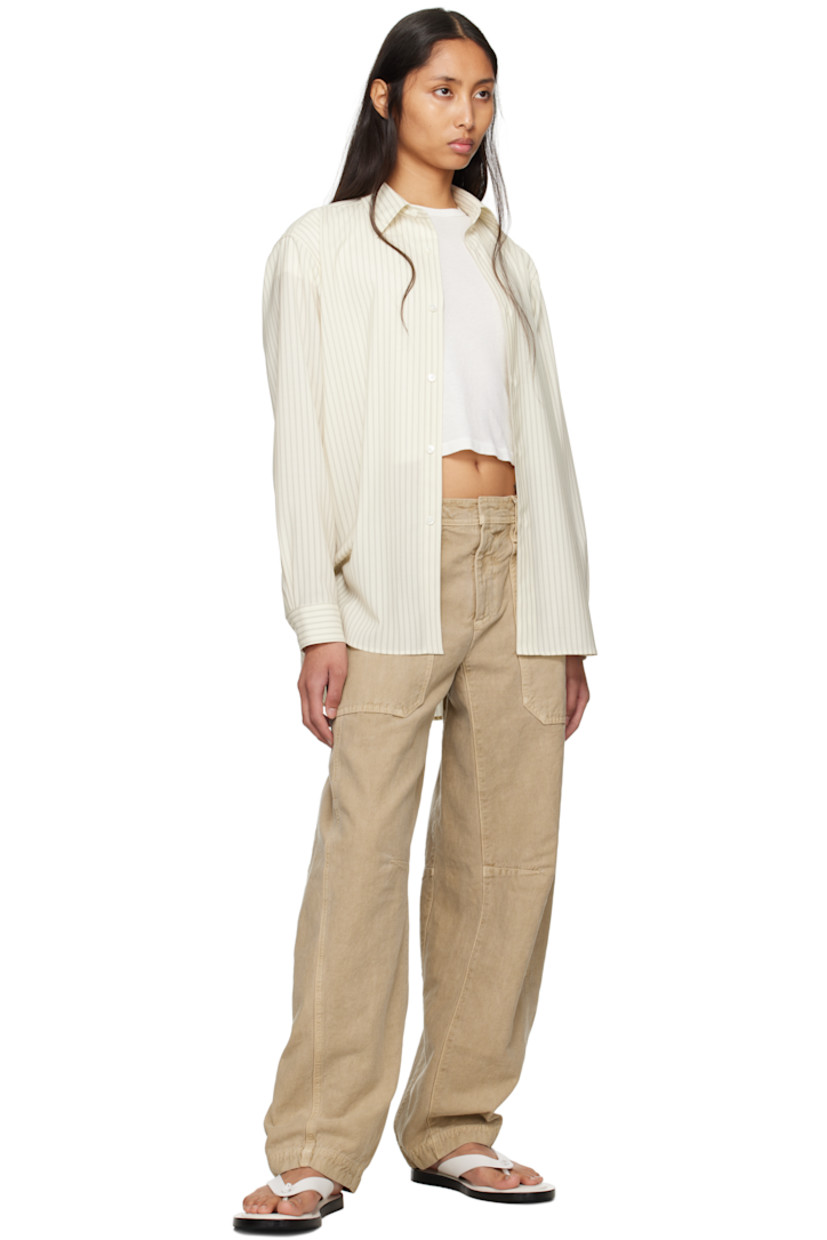 Tapered garment-dyed lightweight cotton canvas cargo pants. 

· BCI-certified
· Low-rise
· Belt loops
· Four-pocket styling
· Zip fly
· Tuck at knees
· Curved outseams

Supplier color: Marfa sands