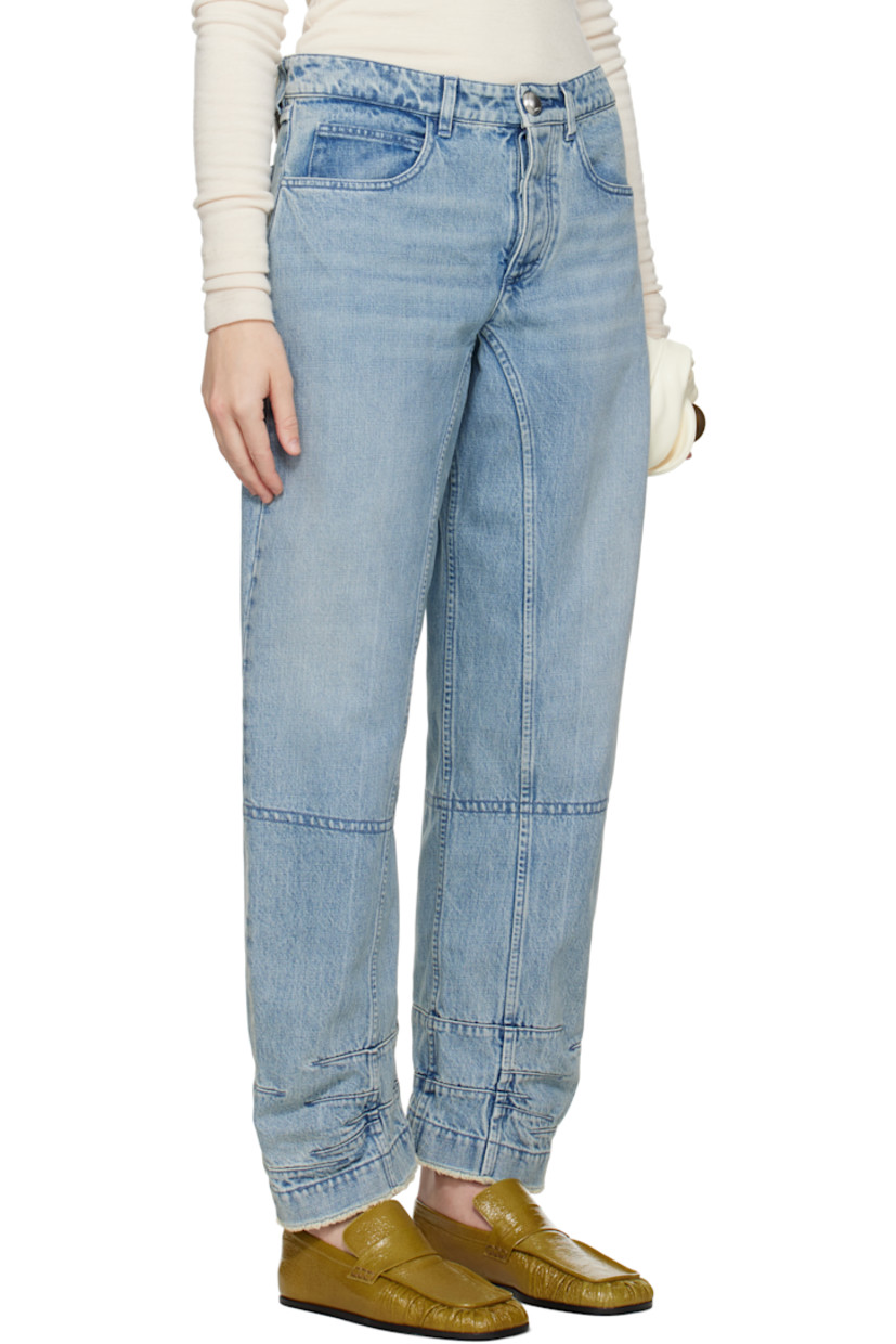 Loose-fit non-stretch organic cotton denim jeans. Fading and whiskering throughout.

· Paneled construction
· Belt loops
· Five-pocket styling
· Button fly
· Darts and frayed edge at cuffs
· Logo patch at back waistband 

Supplier color: Antarctic