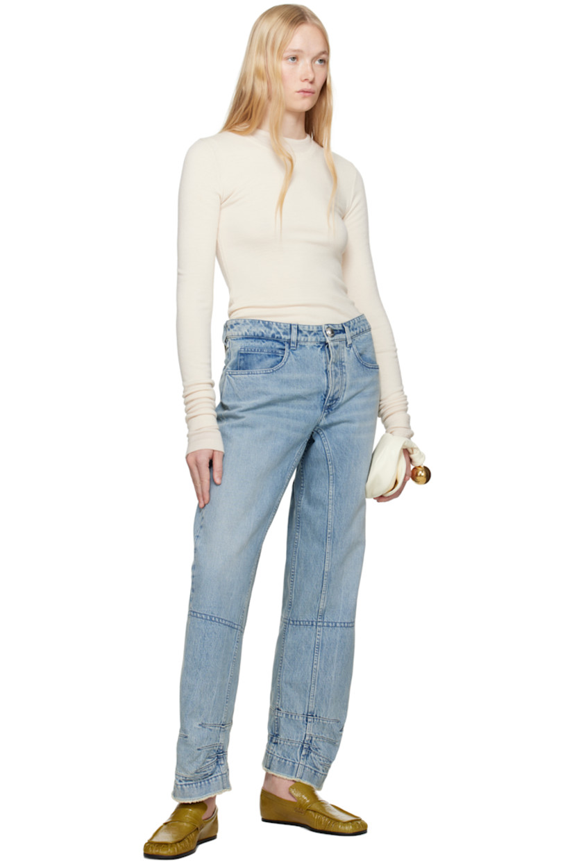 Loose-fit non-stretch organic cotton denim jeans. Fading and whiskering throughout.

· Paneled construction
· Belt loops
· Five-pocket styling
· Button fly
· Darts and frayed edge at cuffs
· Logo patch at back waistband 

Supplier color: Antarctic