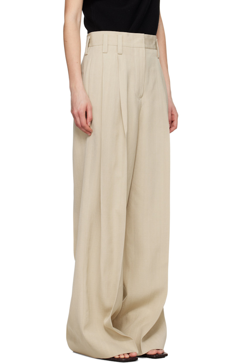 Wide-leg viscose- and silk-blend canvas trousers.

· Belt loops
· Four-pocket styling
· Zip fly
· Pleats at front
· Creased legs
· Unfinished hem
· Partial plain-woven lining

Supplier color: Canvas beige