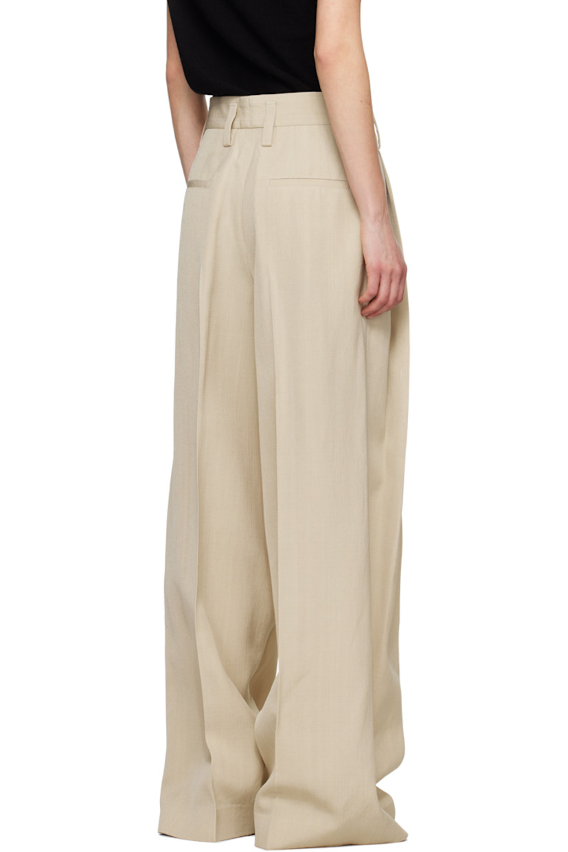 Wide-leg viscose- and silk-blend canvas trousers.

· Belt loops
· Four-pocket styling
· Zip fly
· Pleats at front
· Creased legs
· Unfinished hem
· Partial plain-woven lining

Supplier color: Canvas beige