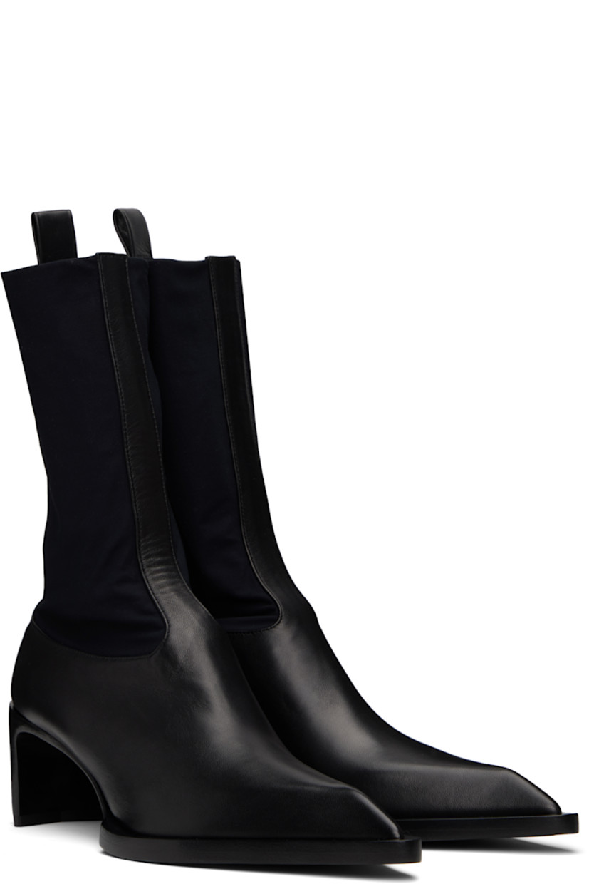 Ankle-high buffed sheepskin and bonded jersey boots in black.

· Pointed toe
· Sock-style collar
· Pull-loop at heel collar
· Buffed nappa leather lining
· Stacked leather heel with rubber injection
· Calfskin sole with rubber injection
· Heel: H2.5"

Supplier color: Black