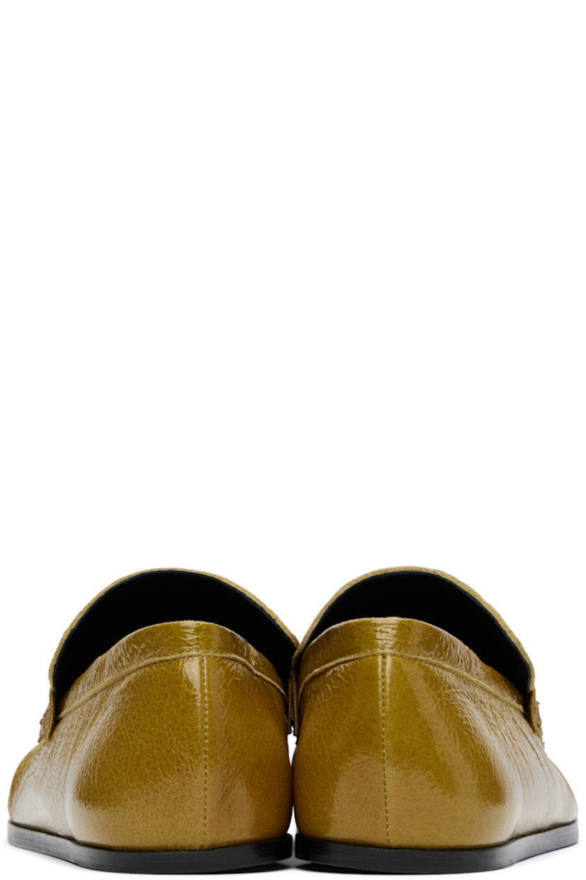 Hand-stitched crinkled patent goatskin loafers in yellow.

· Gathering at square moc toe
· Strap at vamp
· Nappa leather insole and lining
· Polished calfskin sole with rubber injections

Supplier color: Chartreuse