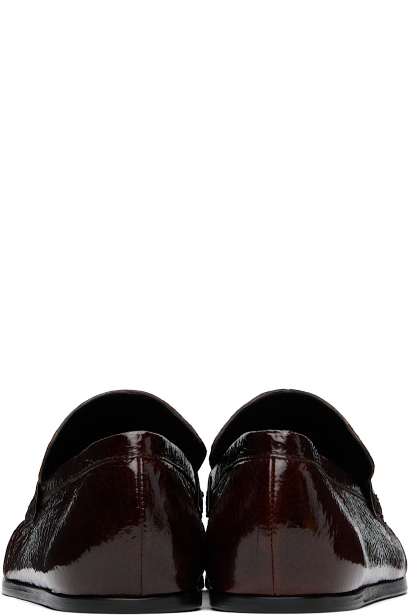 Hand-stitched crinkled patent goatskin loafers in burgundy.

· Gathering at square moc toe
· Strap at vamp
· Nappa leather insole and lining
· Polished calfskin sole with rubber injections

Supplier color: Dark earth
