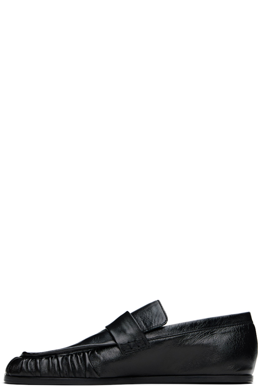 Hand-stitched crinkled sheepskin loafers in black.

· Gathering at square moc toe
· Strap at vamp
· Nappa leather insole and lining
· Polished calfskin sole with rubber injections

Supplier color: Black