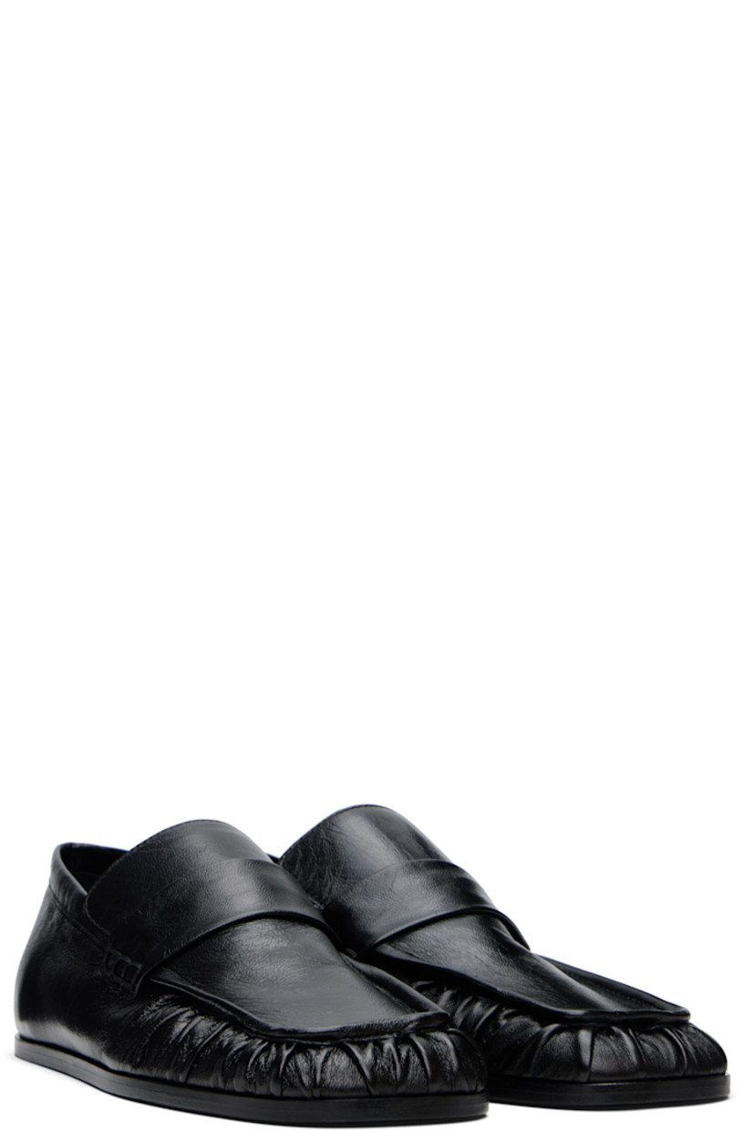 Hand-stitched crinkled sheepskin loafers in black.

· Gathering at square moc toe
· Strap at vamp
· Nappa leather insole and lining
· Polished calfskin sole with rubber injections

Supplier color: Black