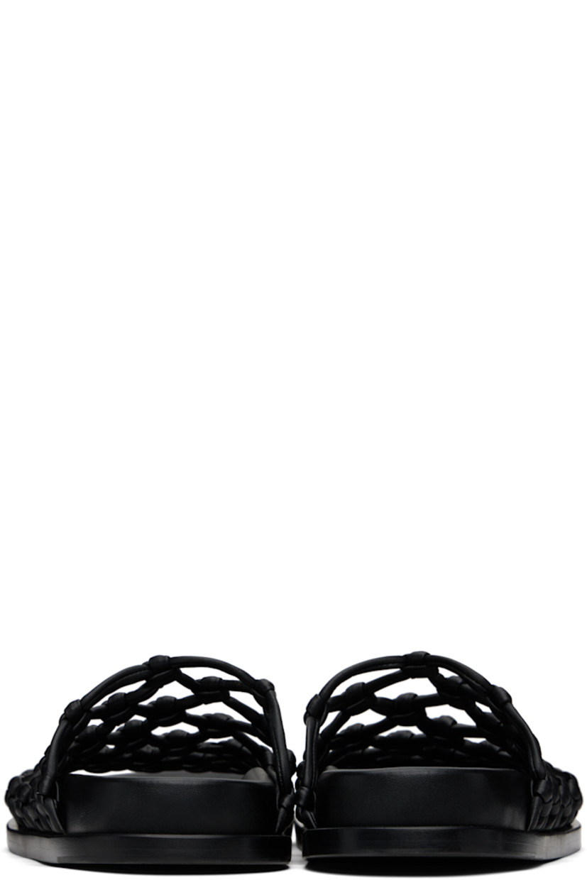 Hand-knotted nappa leather flat sandals in black.

· Open toe
· Logo patch at molded footbed
· Stacked calfskin midsole
· Calfskin sole with rubber injections

Supplier color: Black