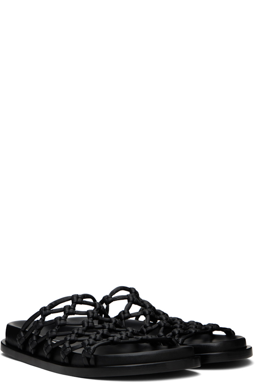 Hand-knotted nappa leather flat sandals in black.

· Open toe
· Logo patch at molded footbed
· Stacked calfskin midsole
· Calfskin sole with rubber injections

Supplier color: Black