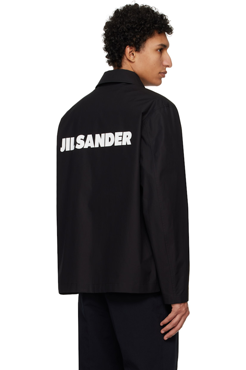 Relaxed-fit lightweight cotton poplin jacket. 

· Spread collar
· Press-stud closure 
· Welt pockets
· Press-stud fastening at cuffs
· Logo printed at back
· Patch pocket at interior
· Partial plain-woven cotton lining

Supplier color: Black