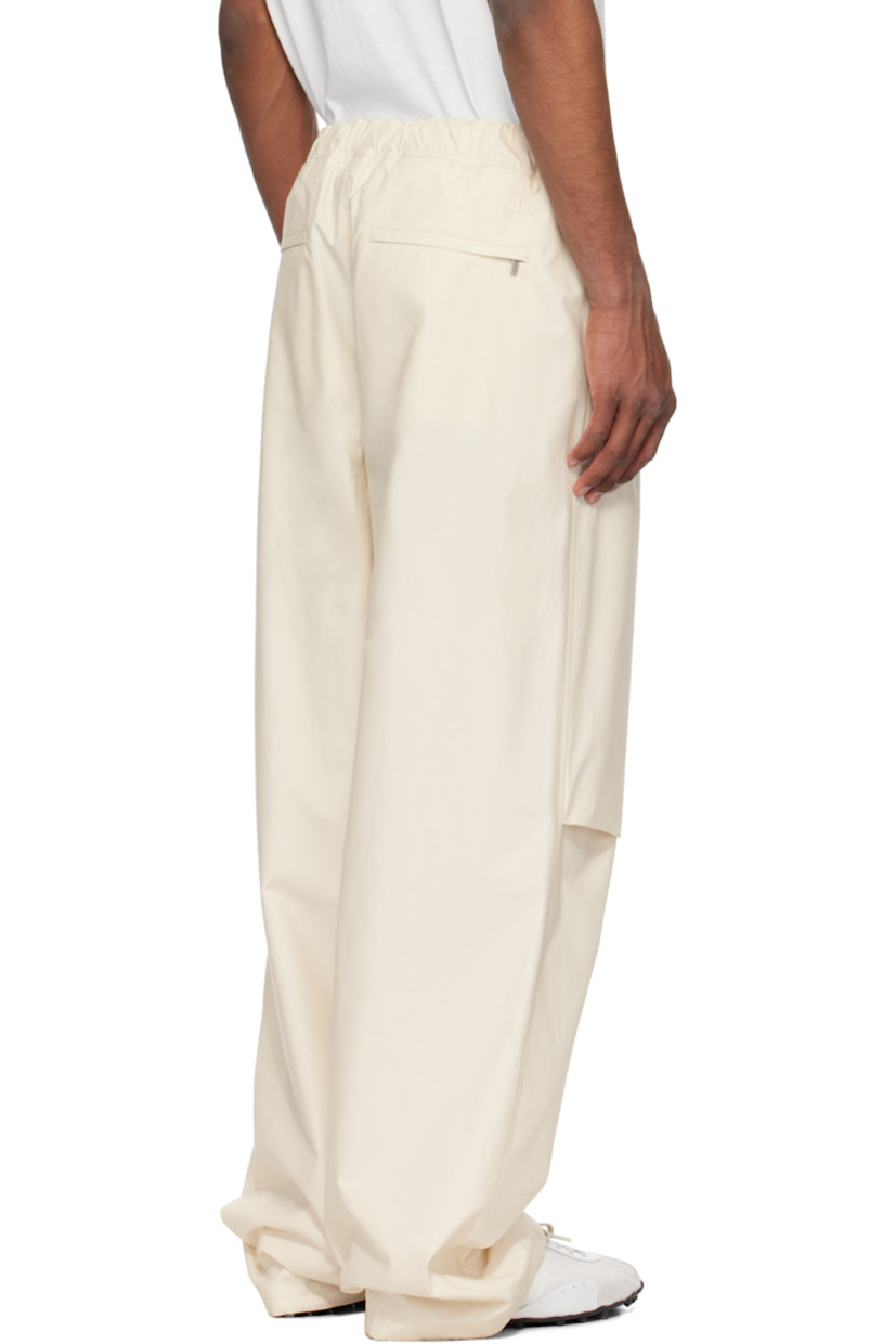 Peached cotton twill trousers.

· Water-repellent
· Integrated cinch belt at partially elasticized waistband
· Four-pocket styling
· Zip fly
· Pleat at knees
· Drawstring at inner cuffs
· Logo embroidered at back

Supplier color: Natural