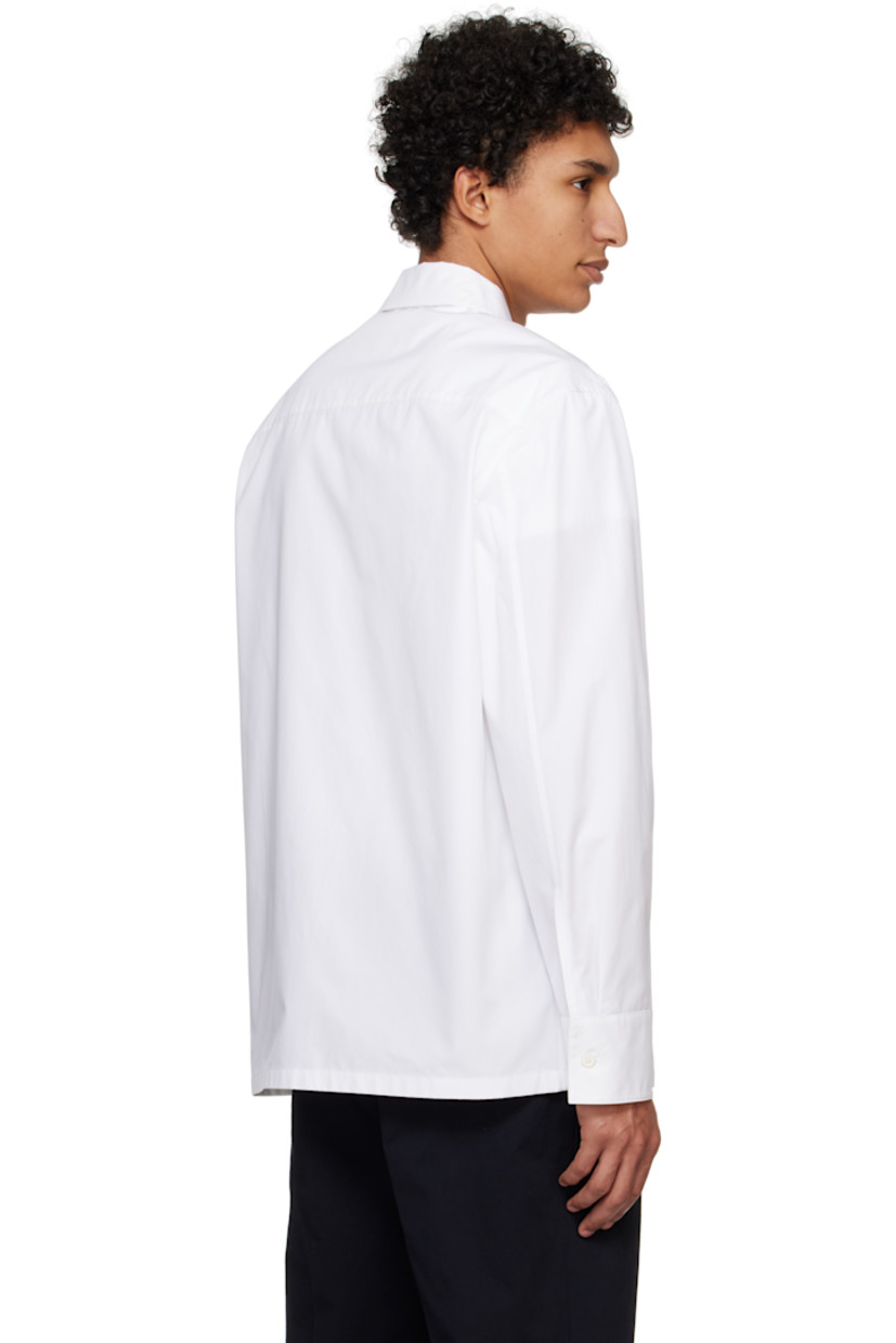 Cotton poplin shirt. 

· Spread collar
· Zip closure
· Seam pockets
· Single-button barrel cuffs

Supplier color: Optic white