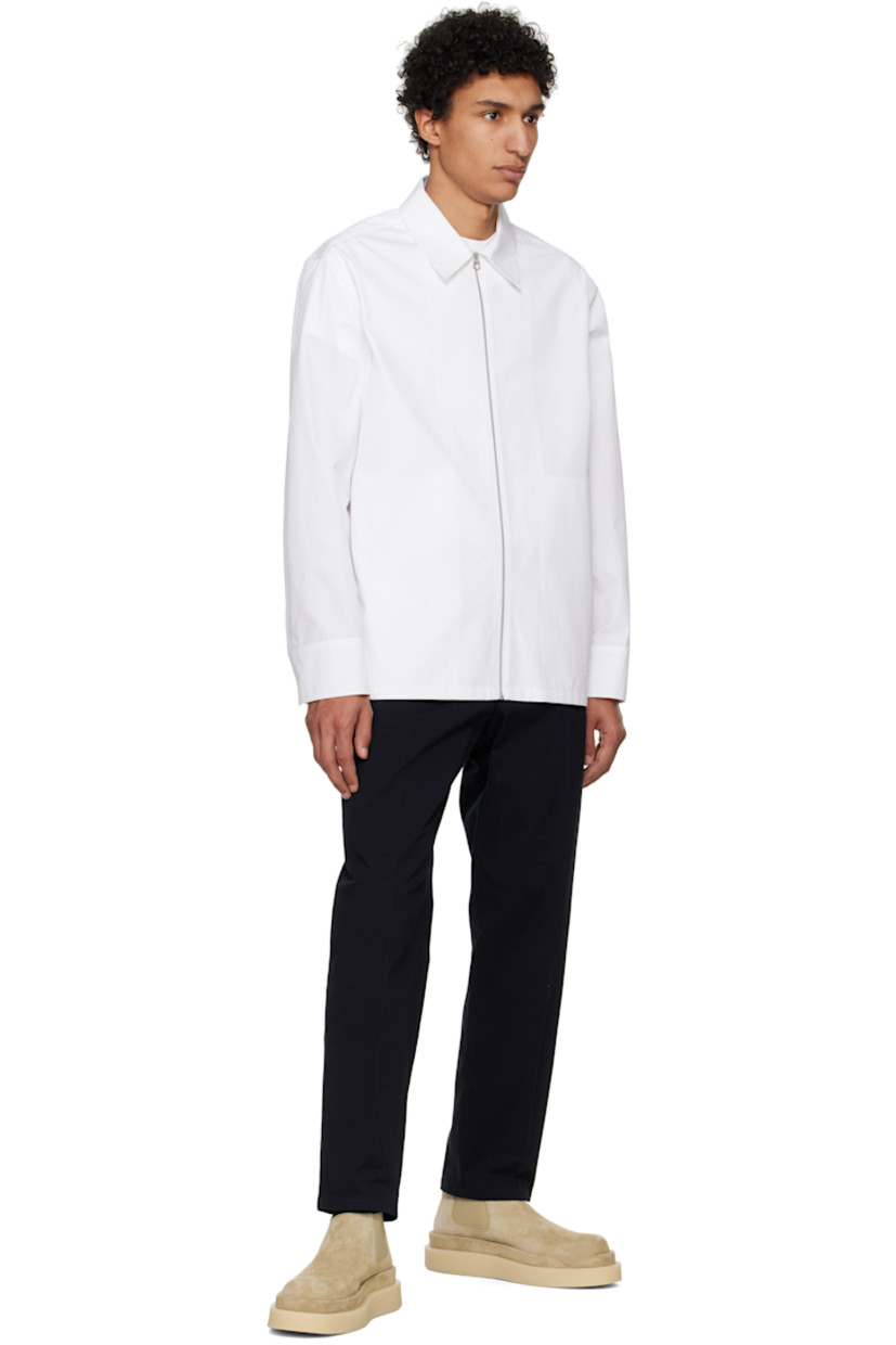 Cotton poplin shirt. 

· Spread collar
· Zip closure
· Seam pockets
· Single-button barrel cuffs

Supplier color: Optic white