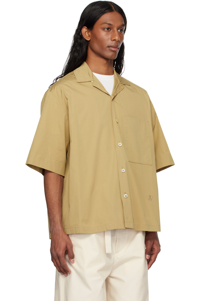Loose-fit cotton poplin shirt.

· Open spread collar
· Button closure
· Patch pocket
· Logo embroidered at front
· Dropped shoulders
· Horn hardware

Supplier color: Cereal