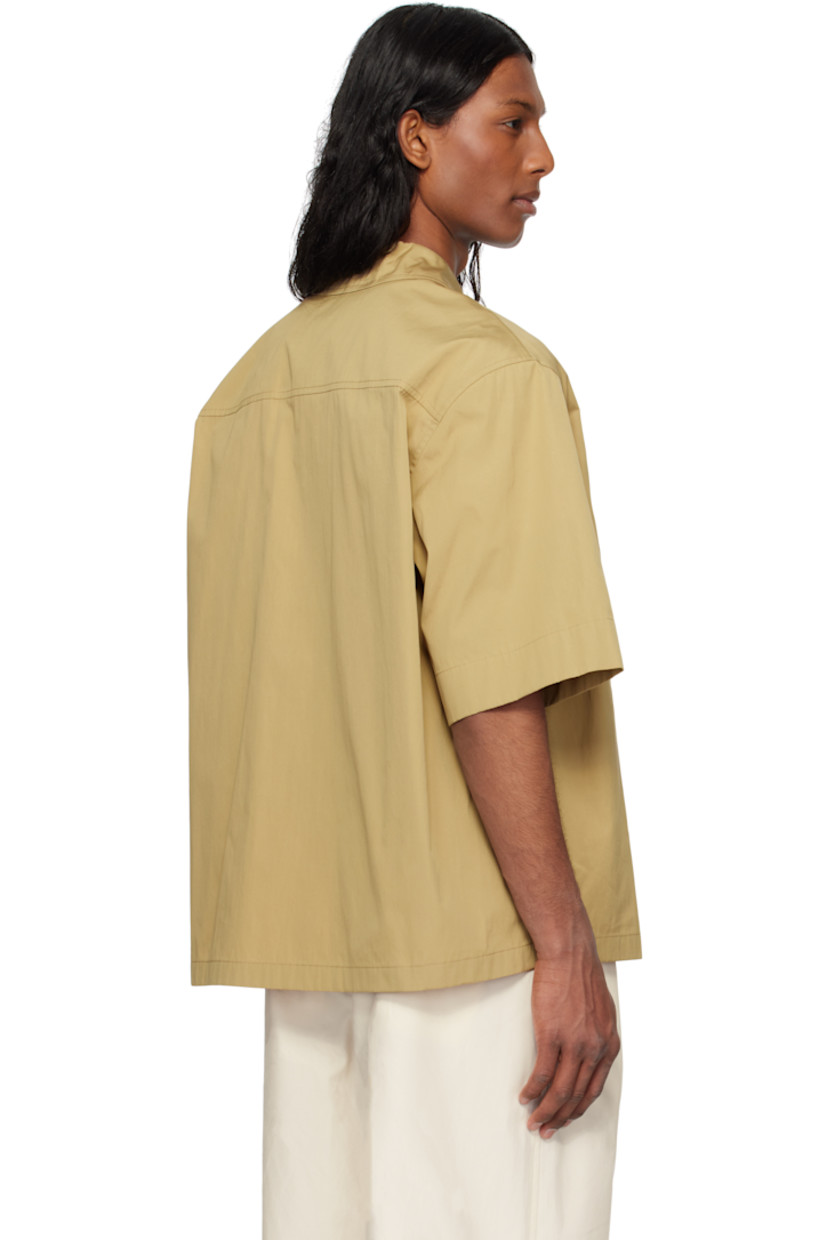 Loose-fit cotton poplin shirt.

· Open spread collar
· Button closure
· Patch pocket
· Logo embroidered at front
· Dropped shoulders
· Horn hardware

Supplier color: Cereal