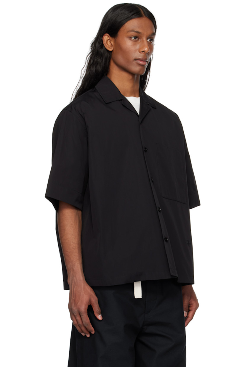 Loose-fit cotton poplin shirt.

· Open spread collar
· Button closure
· Patch pocket
· Logo embroidered at front
· Dropped shoulders
· Horn hardware

Supplier color: Black