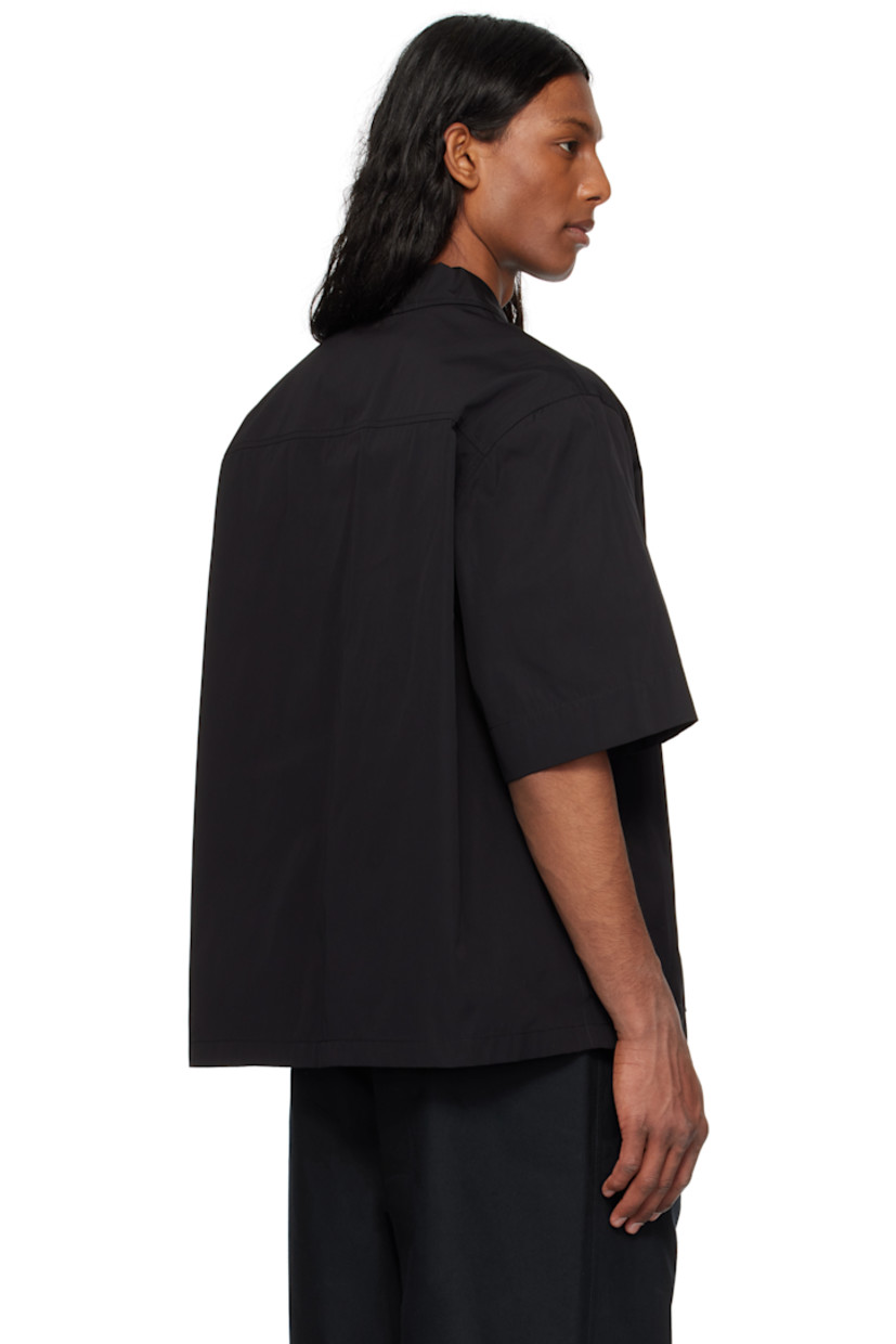 Loose-fit cotton poplin shirt.

· Open spread collar
· Button closure
· Patch pocket
· Logo embroidered at front
· Dropped shoulders
· Horn hardware

Supplier color: Black