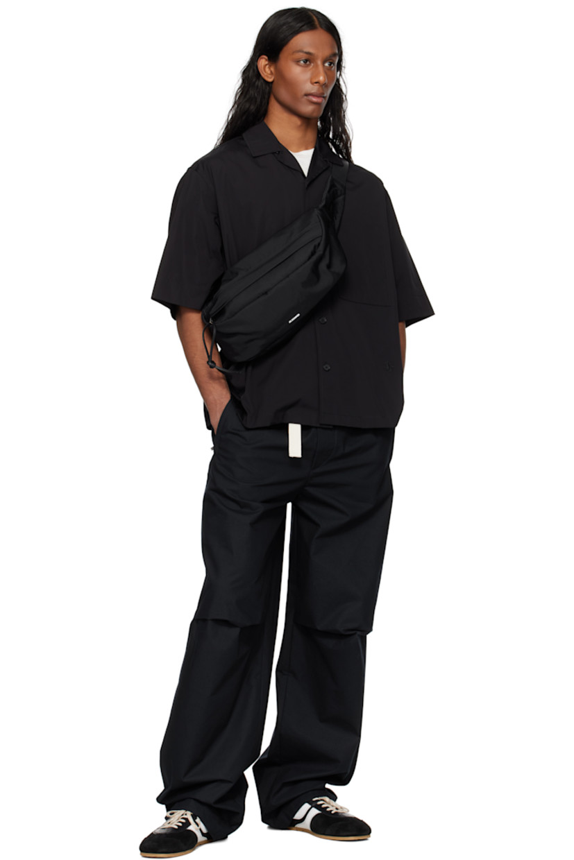 Loose-fit cotton poplin shirt.

· Open spread collar
· Button closure
· Patch pocket
· Logo embroidered at front
· Dropped shoulders
· Horn hardware

Supplier color: Black