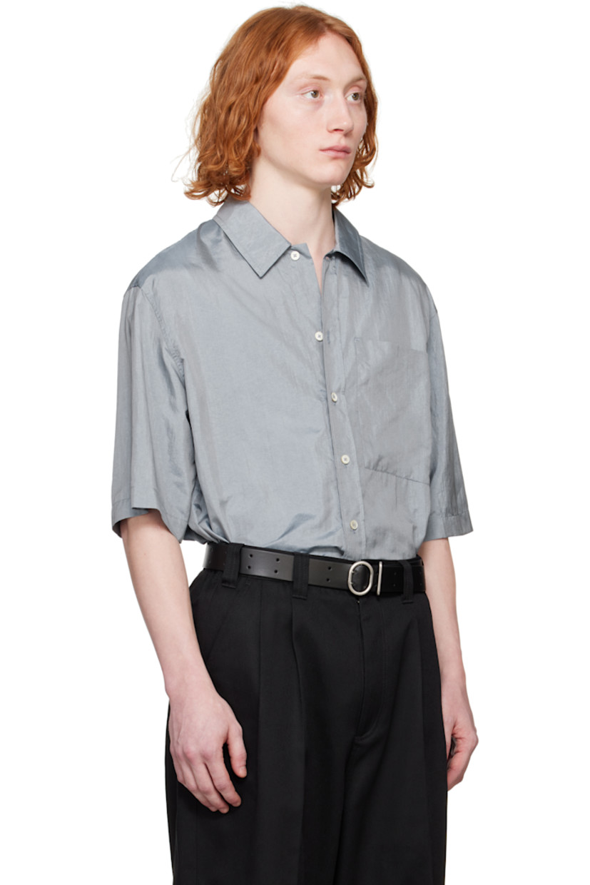Crinkled nylon- and silk-blend canvas shirt. 

· Spread collar
· Button closure
· Patch pocket 
· Vented side seams
· Dropped shoulders
· Twin pleats at back yoke 
· Logo patch at back hem 

Supplier color: Pewter blue