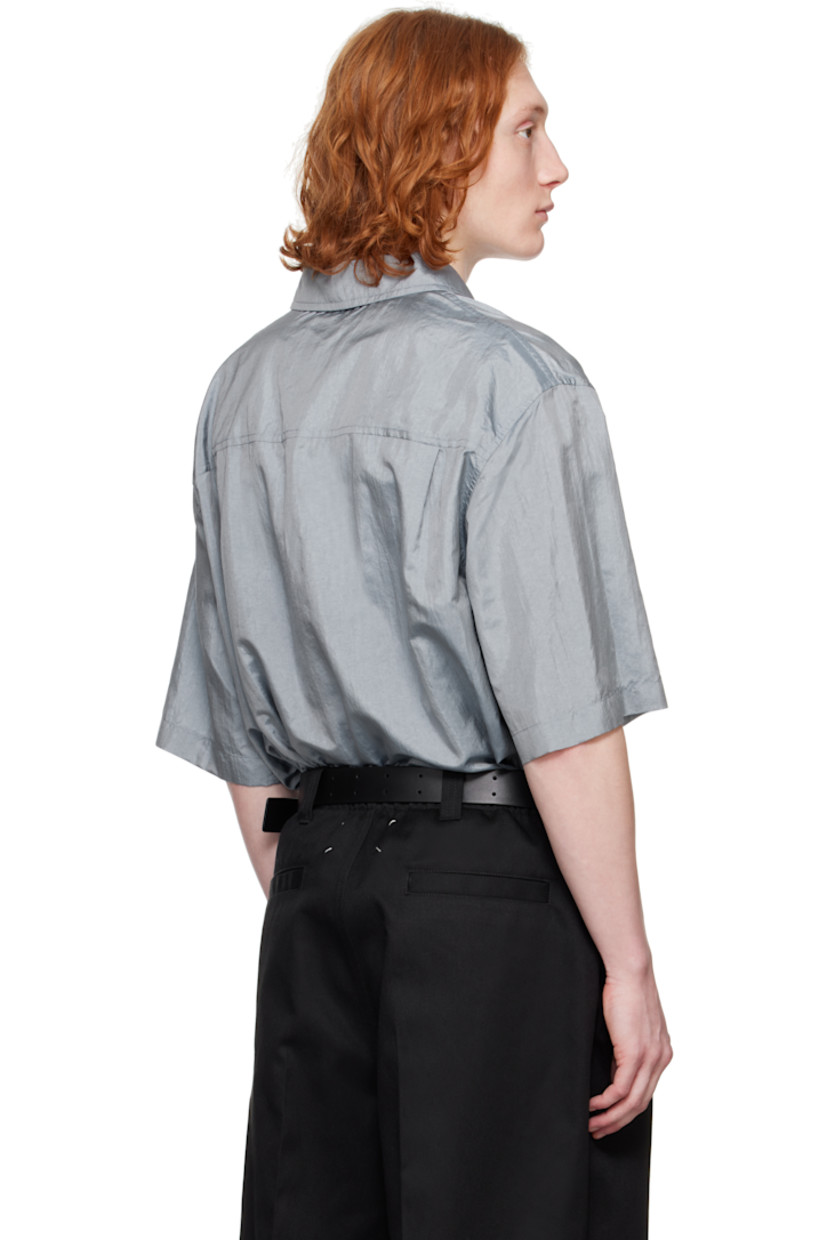 Crinkled nylon- and silk-blend canvas shirt. 

· Spread collar
· Button closure
· Patch pocket 
· Vented side seams
· Dropped shoulders
· Twin pleats at back yoke 
· Logo patch at back hem 

Supplier color: Pewter blue