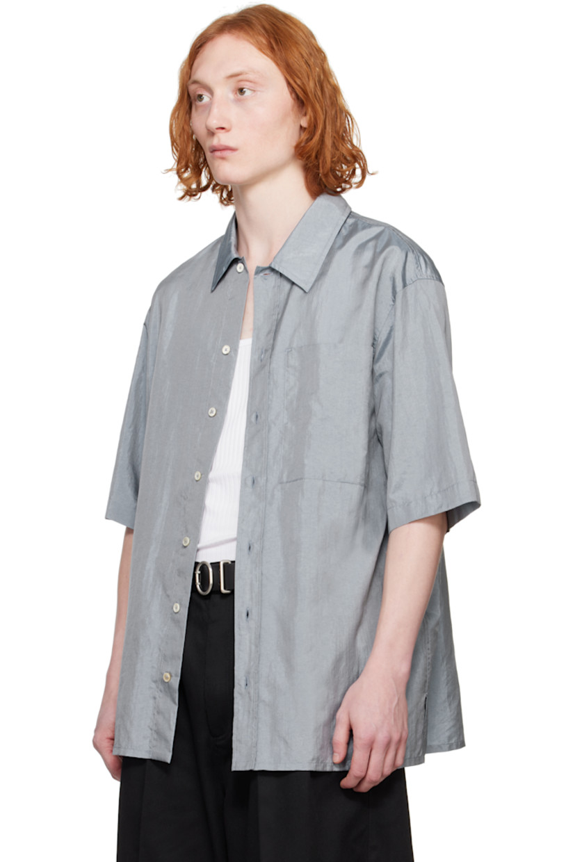 Crinkled nylon- and silk-blend canvas shirt. 

· Spread collar
· Button closure
· Patch pocket 
· Vented side seams
· Dropped shoulders
· Twin pleats at back yoke 
· Logo patch at back hem 

Supplier color: Pewter blue