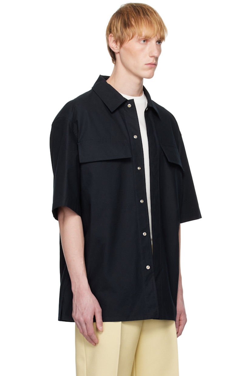 Relaxed-fit slub organic cotton poplin shirt. Water-repellent.

· Spread collar
· Concealed press-stud closure
· Flap pockets
· Logo embroidered at front
· Vented side seams
· Dropped shoulders

Supplier color: Dark navy