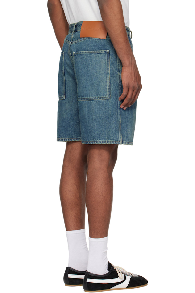 Non-stretch selvage denim shorts. Fading throughout.

· Belt loops
· Four-pocket styling
· Button fly
· Patch pockets at outseam
· Leather logo patch at back waistband
· Contrast stitching in white and beige

Supplier color: Blue