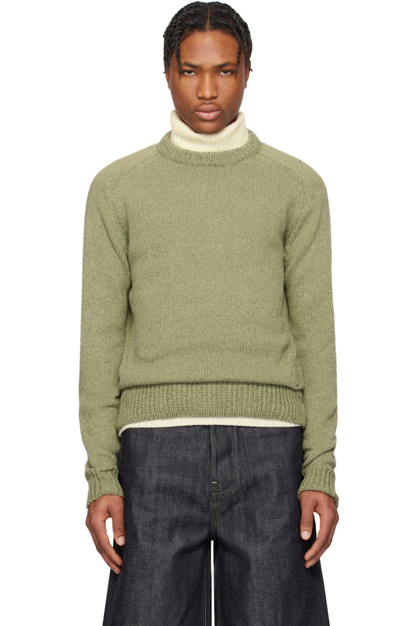 Knit cotton- and wool-blend sweater.

· Rib-knit crewneck, hem, and cuffs
· Logo embroidered at front hem
· Saddle shoulders

Supplier color: Slate green
