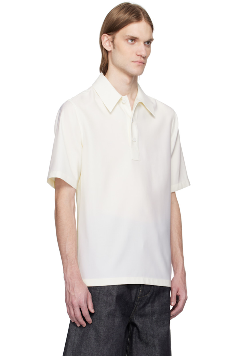 Virgin wool canvas polo. 

· Spread collar
· Three-button placket
· Partial viscose twill lining

Supplier color: Chalk
