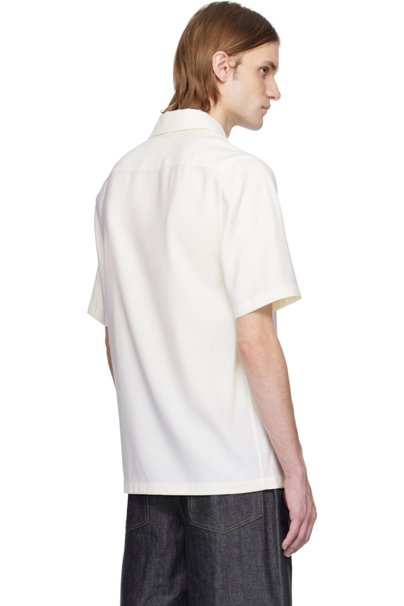 Virgin wool canvas polo. 

· Spread collar
· Three-button placket
· Partial viscose twill lining

Supplier color: Chalk