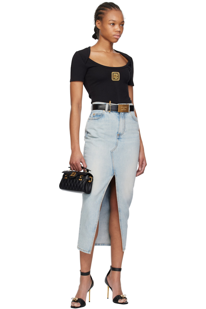 Grained calfskin belt in black. 

· Logo hardware at post-stud fastening
· Safety-pin-style keeper loop 
· W1.25"

Supplier color: Black