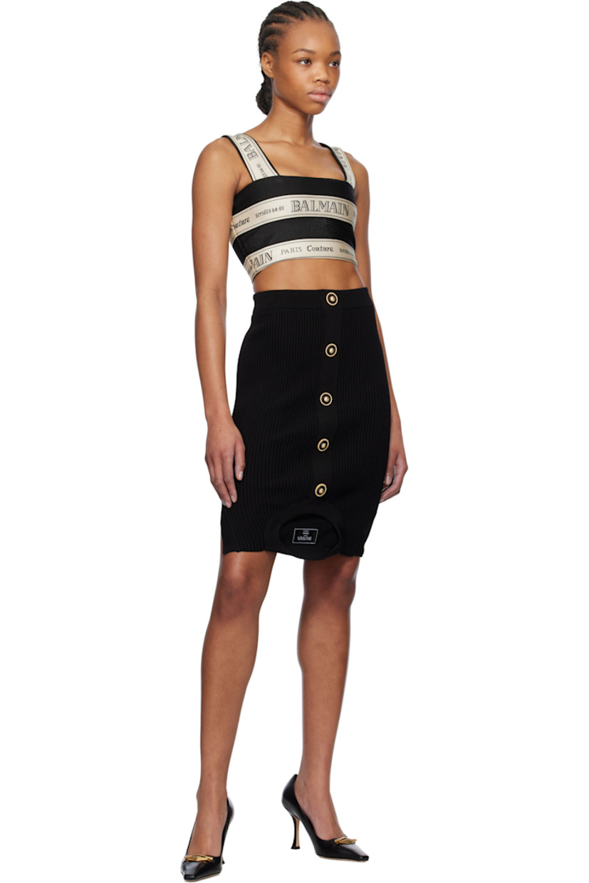 Rib-knit viscose-blend miniskirt. 

· High-rise
· Elasticized waistband 
· Mock button closure
· Crewneck, logo patch, and armscyes at hem
· Logo-engraved gold-tone hardware

Supplier color: Black