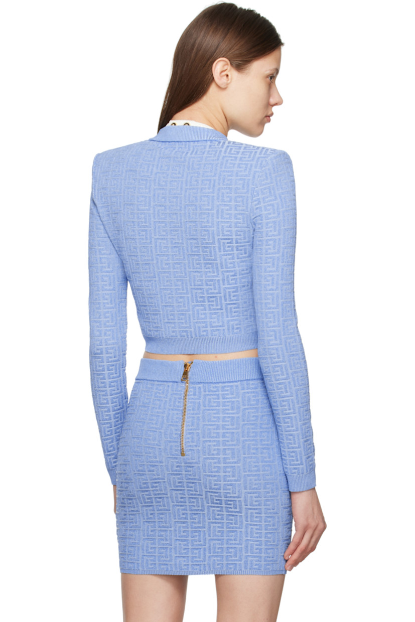 Slim-fit knit viscose-blend cardigan. Metallic thread detailing and jacquard logo pattern throughout. 

· Rib-knit crewneck, hem, and cuffs
· Press-stud closure
· Cropped hem
· Padded shoulders
· Logo-engraved gold-tone hardware

Supplier color: Bleu/Bleu brilla