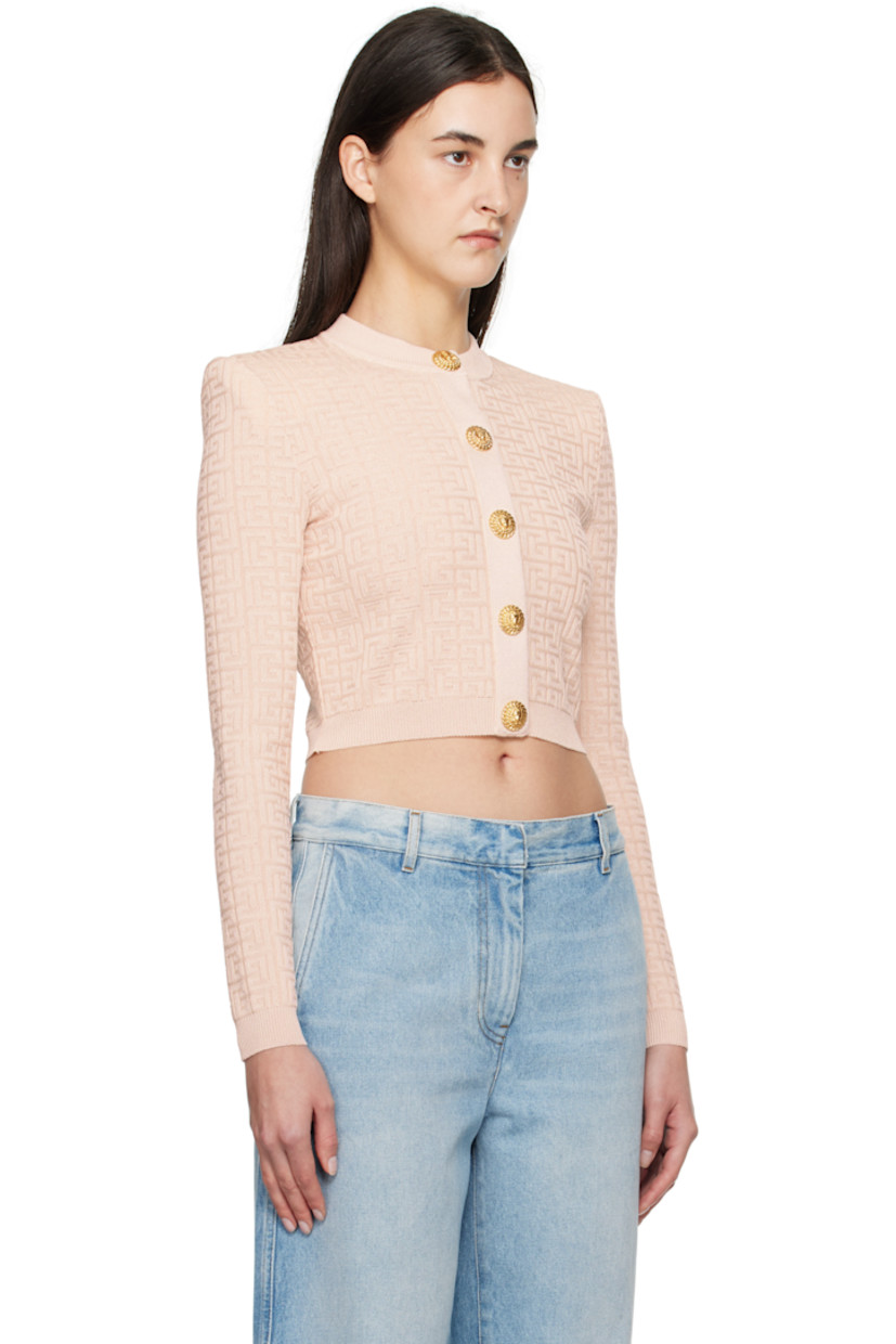 Knit viscose-blend cardigan. Jacquard logo pattern and metallic thread detailing throughout.

· Rib-knit crewneck, hem, and cuffs
· Press-stud closure
· Padded shoulders
· Graphic-engraved gold-tone hardware

Supplier color: Beige