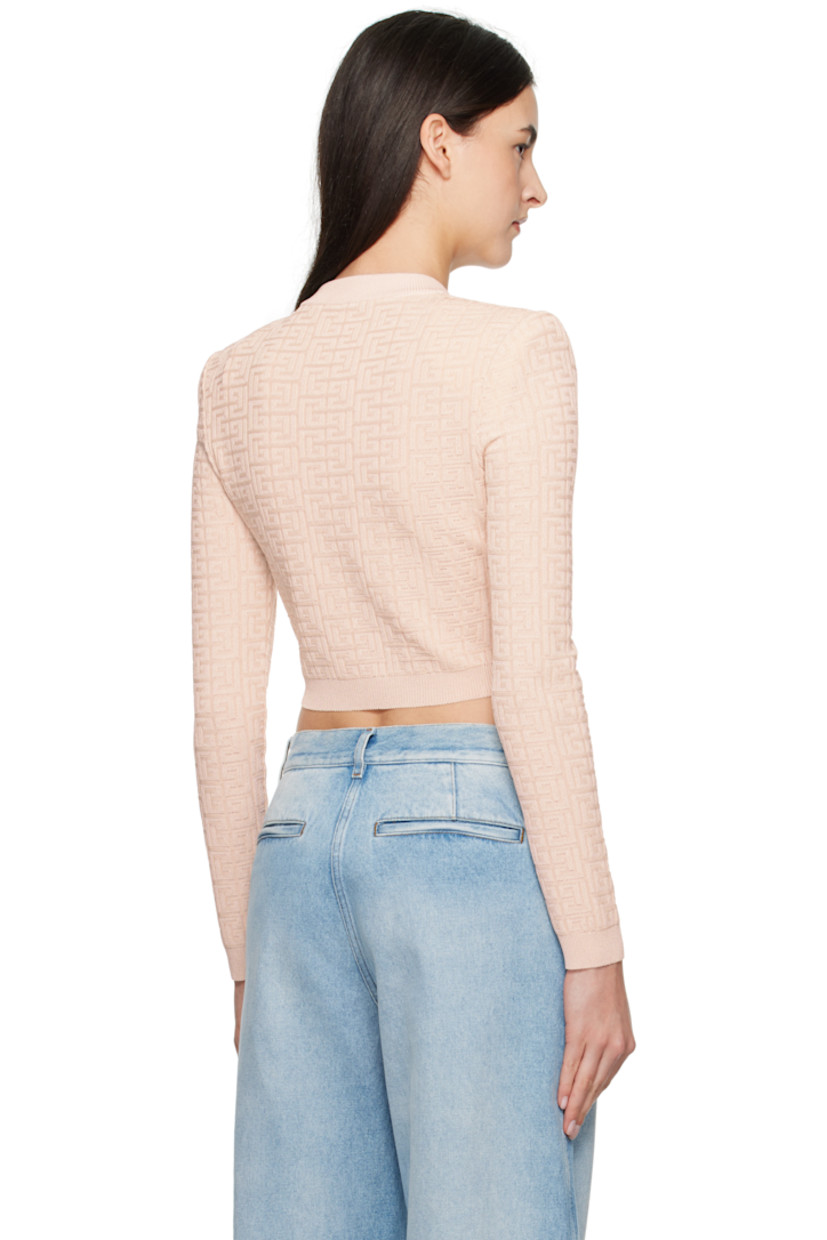 Knit viscose-blend cardigan. Jacquard logo pattern and metallic thread detailing throughout.

· Rib-knit crewneck, hem, and cuffs
· Press-stud closure
· Padded shoulders
· Graphic-engraved gold-tone hardware

Supplier color: Beige