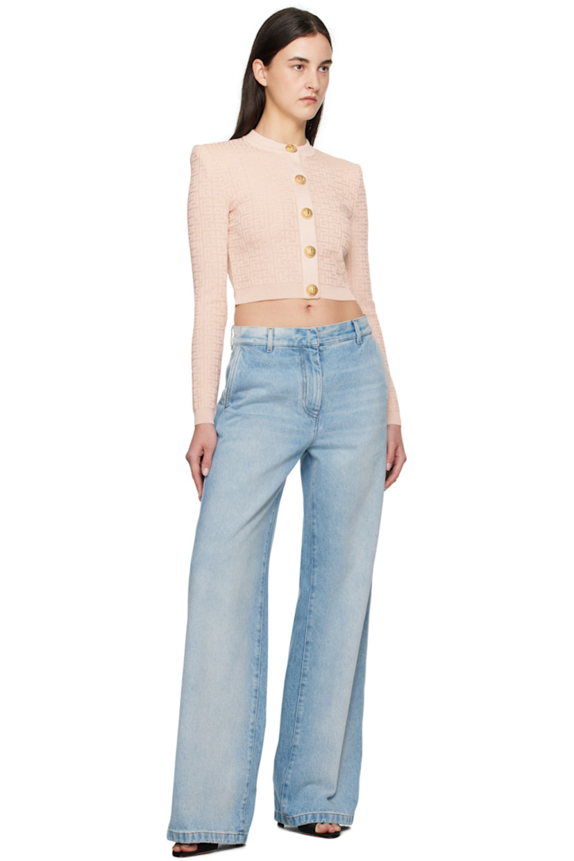 Knit viscose-blend cardigan. Jacquard logo pattern and metallic thread detailing throughout.

· Rib-knit crewneck, hem, and cuffs
· Press-stud closure
· Padded shoulders
· Graphic-engraved gold-tone hardware

Supplier color: Beige