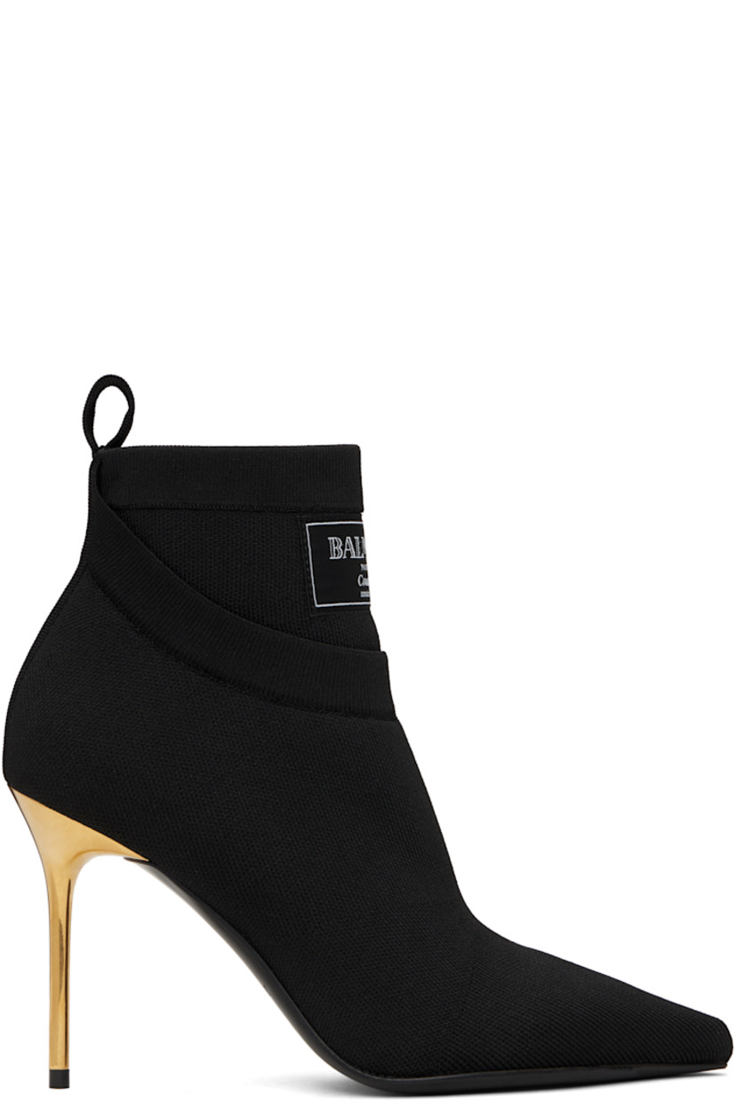 Ankle-high knit stretch recycled polyester-blend boots in black.

· Layered construction
· Pointed toe
· Logo patch at rib-knit collar
· Pull-loop at heel collar
· Suede lining
· Stiletto heel with rubber injection
· Calfskin sole with rubber injection
· Heel: H3.75"

Supplier color: Black