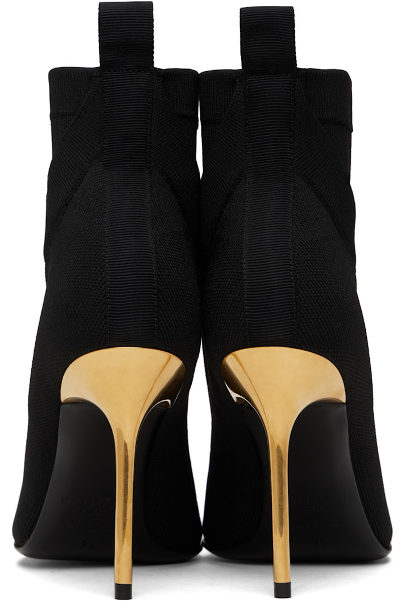 Ankle-high knit stretch recycled polyester-blend boots in black.

· Layered construction
· Pointed toe
· Logo patch at rib-knit collar
· Pull-loop at heel collar
· Suede lining
· Stiletto heel with rubber injection
· Calfskin sole with rubber injection
· Heel: H3.75"

Supplier color: Black
