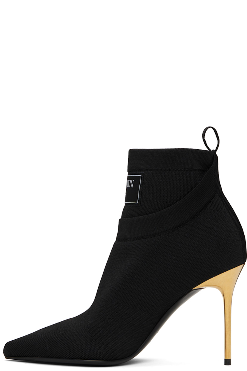 Ankle-high knit stretch recycled polyester-blend boots in black.

· Layered construction
· Pointed toe
· Logo patch at rib-knit collar
· Pull-loop at heel collar
· Suede lining
· Stiletto heel with rubber injection
· Calfskin sole with rubber injection
· Heel: H3.75"

Supplier color: Black