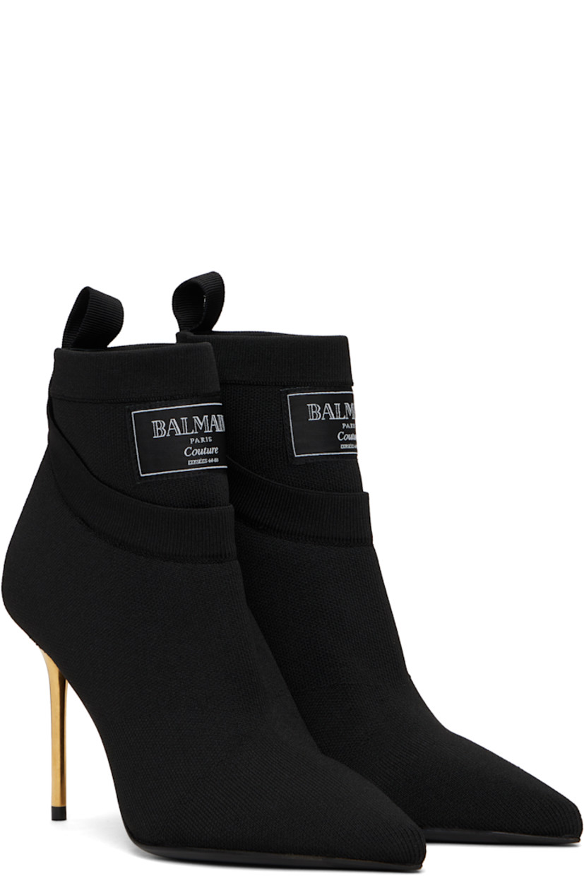 Ankle-high knit stretch recycled polyester-blend boots in black.

· Layered construction
· Pointed toe
· Logo patch at rib-knit collar
· Pull-loop at heel collar
· Suede lining
· Stiletto heel with rubber injection
· Calfskin sole with rubber injection
· Heel: H3.75"

Supplier color: Black